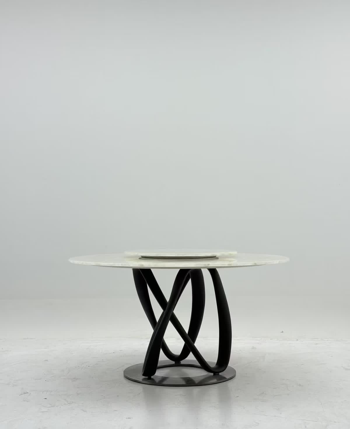 Round dining table with sculptural base — reference photo 2