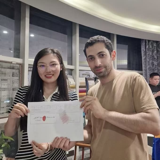 A buyer reviews a drawing with the TY team